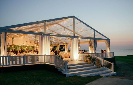 clear wedding tent, custom steps, railing, leg skirts, and a clear gable